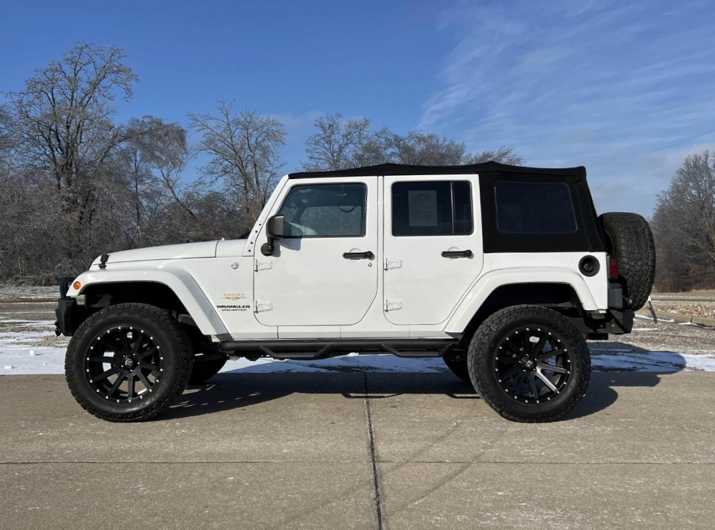 2014 WHITE /Black Cloth Jeep Wrangler Unlimited Sahara (1C4BJWEG1EL) with an 3.6L V6 engine, Automatic transmission, located at 2990 Old Orchard Rd., Jackson, MO, 63755, 37.354214, -89.612106 - 2014 Jeep Wrangler Unlimited Sahara Only 48xxx miles 4x4 3.6L V6 Automatic Local Trade-In 20" Wheels Cruise Power Windows/Locks/Mirrors We have financing available and we accept trades! Fill out a credit application on our website or come by today! If you have any questions, give us a call - Photo#4