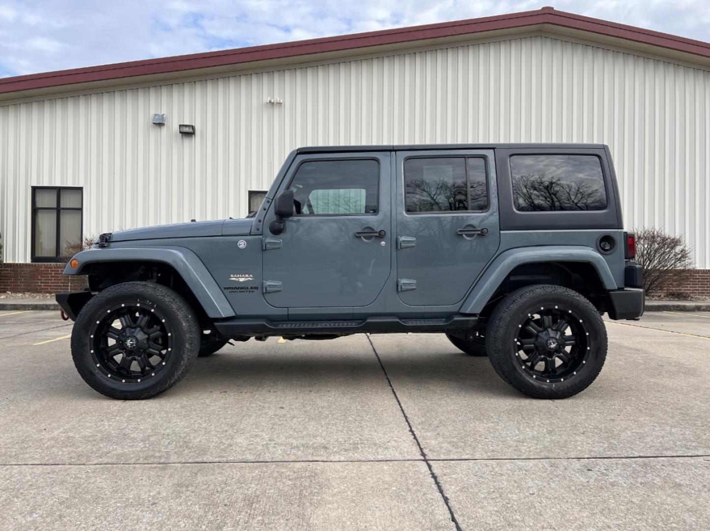 2015 GRAY /Black Cloth JEEP WRANGLER UNLIMI SAHARA (1C4HJWEG7FL) with an 3.6L V6 engine, Automatic transmission, located at 2990 Old Orchard Rd., Jackson, MO, 63755, 37.354214, -89.612106 - 2015 Jeep Wrangler Unlimited Sahara 114xxx miles 4 Wheel Drive 3.6L V6 Automatic Navigation Heated Seats 20" Wheels Bluetooth Cruise Power Windows/Locks/Mirrors We have financing available and we accept trades! Fill out a credit application on our website or come by today! If you have an - Photo#6