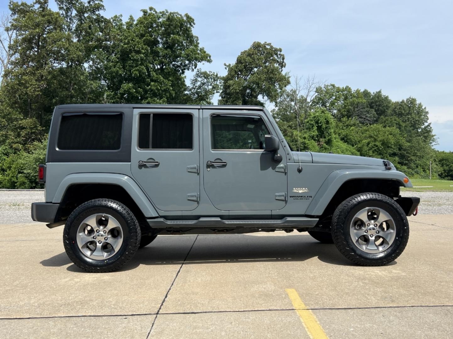 2015 GRAY /Black Cloth JEEP WRANGLER UNLIMI SAHARA (1C4HJWEG7FL) with an 3.6L V6 engine, Automatic transmission, located at 2990 Old Orchard Rd., Jackson, MO, 63755, 37.354214, -89.612106 - 2015 Jeep Wrangler Unlimited Sahara 114xxx miles 4 Wheel Drive 3.6L V6 Automatic Navigation Heated Seats 20" Wheels Bluetooth Cruise Power Windows/Locks/Mirrors We have financing available and we accept trades! Fill out a credit application on our website or come by today! If you have an - Photo#7