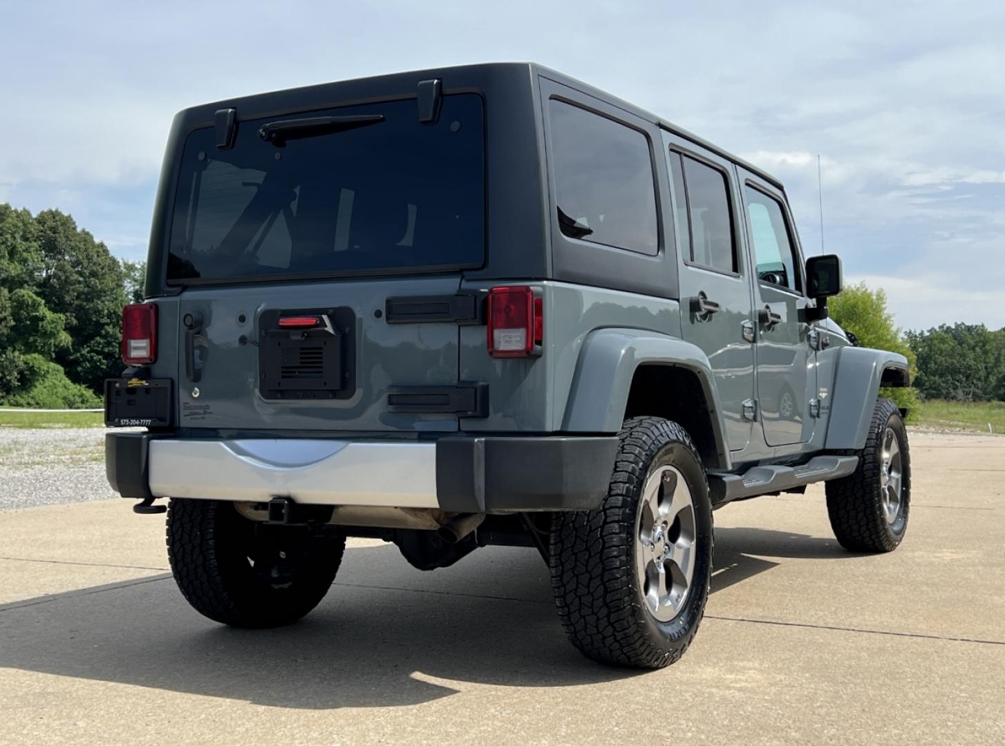 2015 GRAY /Black Cloth JEEP WRANGLER UNLIMI SAHARA (1C4HJWEG7FL) with an 3.6L V6 engine, Automatic transmission, located at 2990 Old Orchard Rd., Jackson, MO, 63755, 37.354214, -89.612106 - 2015 Jeep Wrangler Unlimited Sahara 114xxx miles 4 Wheel Drive 3.6L V6 Automatic Navigation Heated Seats 20" Wheels Bluetooth Cruise Power Windows/Locks/Mirrors We have financing available and we accept trades! Fill out a credit application on our website or come by today! If you have an - Photo#8