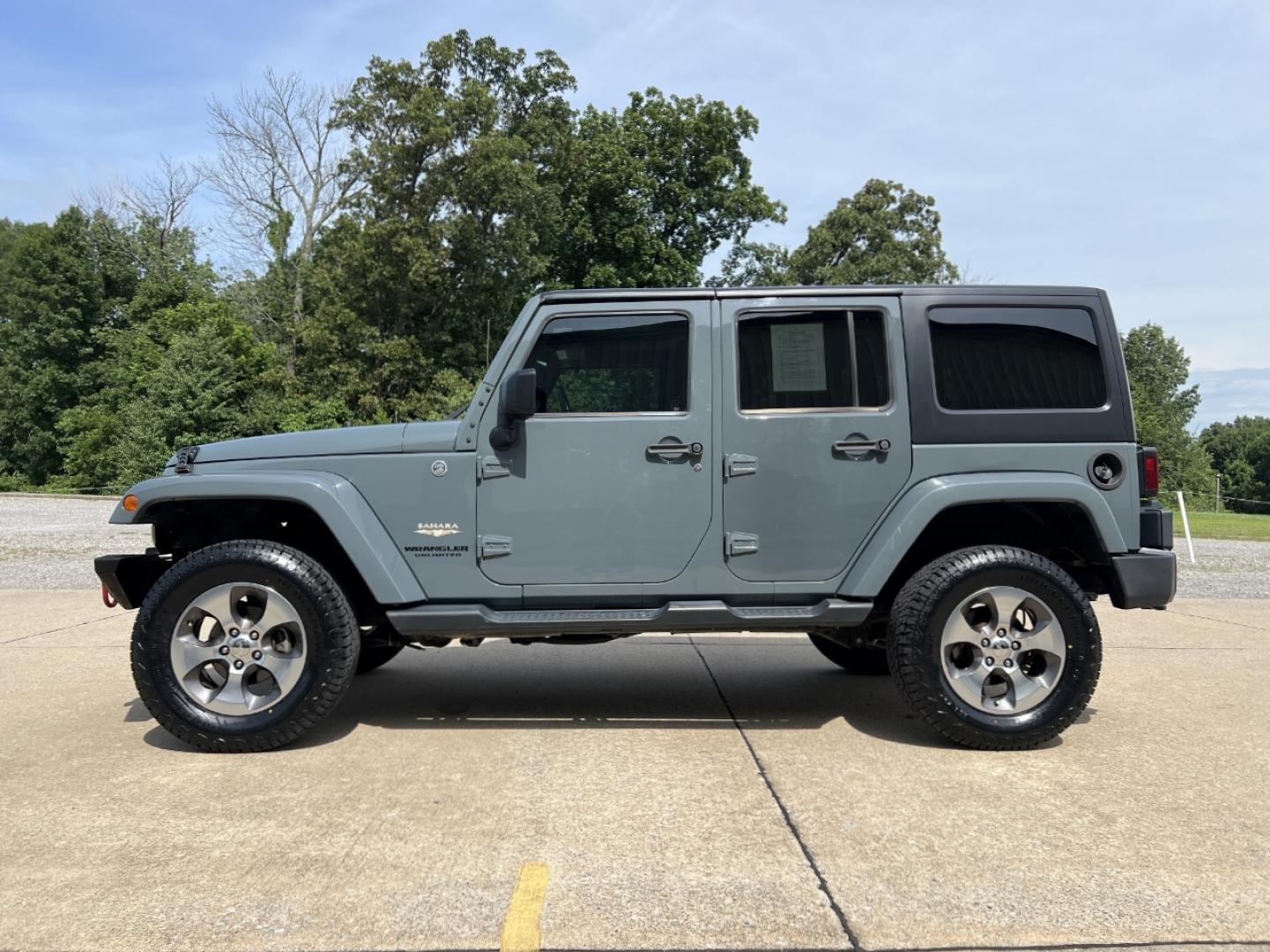 2015 GRAY /Black Cloth JEEP WRANGLER UNLIMI SAHARA (1C4HJWEG7FL) with an 3.6L V6 engine, Automatic transmission, located at 2990 Old Orchard Rd., Jackson, MO, 63755, 37.354214, -89.612106 - 2015 Jeep Wrangler Unlimited Sahara 114xxx miles 4 Wheel Drive 3.6L V6 Automatic Navigation Heated Seats 20" Wheels Bluetooth Cruise Power Windows/Locks/Mirrors We have financing available and we accept trades! Fill out a credit application on our website or come by today! If you have an - Photo#6