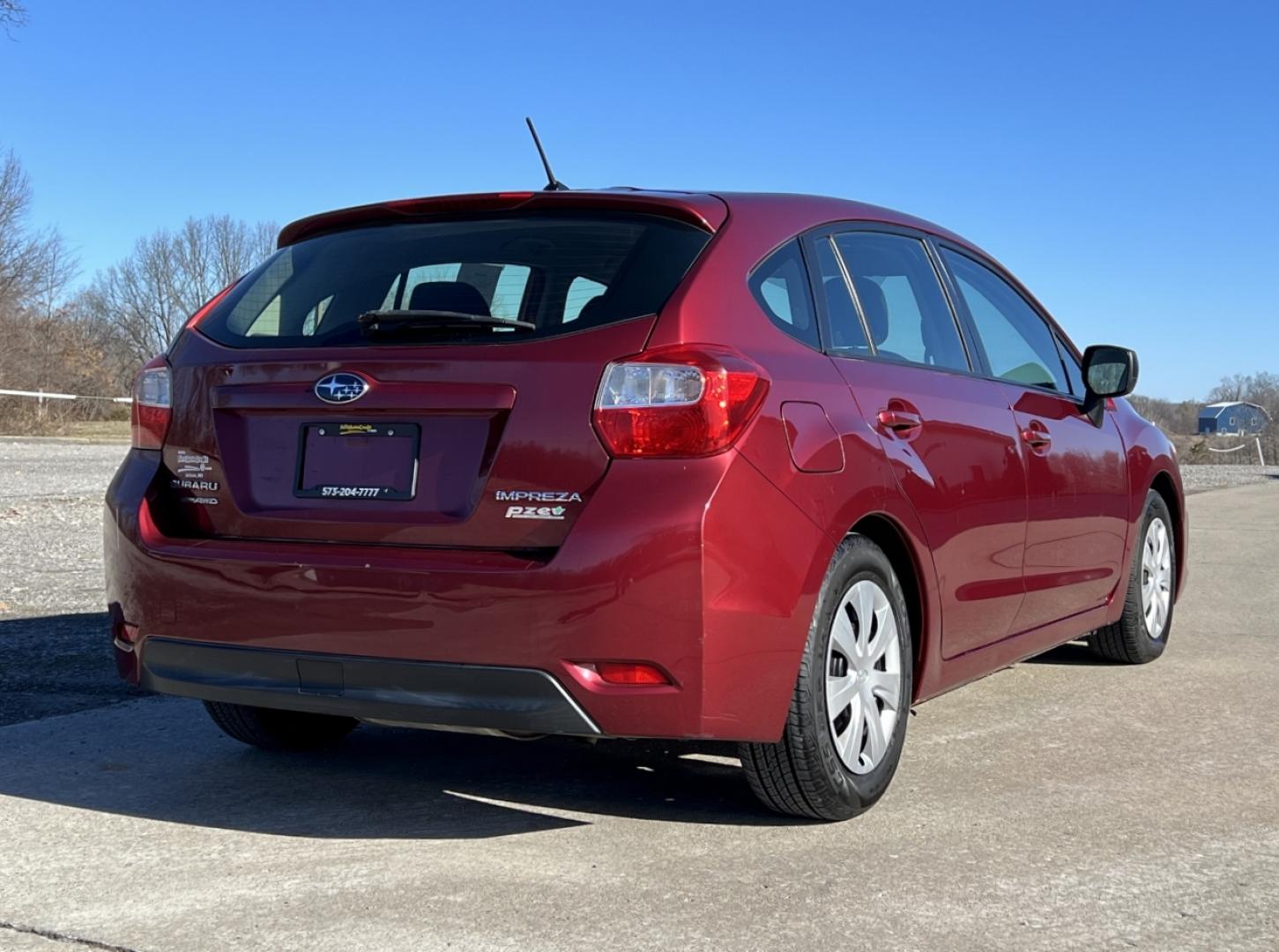 2013 MAROON /Black Cloth SUBARU IMPREZA (JF1GPAA62D2) with an 2.0L 4 Cyl. engine, Continuously Variable transmission, located at 2990 Old Orchard Rd., Jackson, MO, 63755, 37.354214, -89.612106 - 2013 Subaru Impreza 124xxx miles All Wheel Drive 2.0L 4 Cyl. Automatic Cruise Power Windows/Locks/Mirrors We have financing available and we accept trades! Fill out a credit application on our website or come by today! If you have any questions, give us a call at (573) 204-7777 or visit our - Photo#5