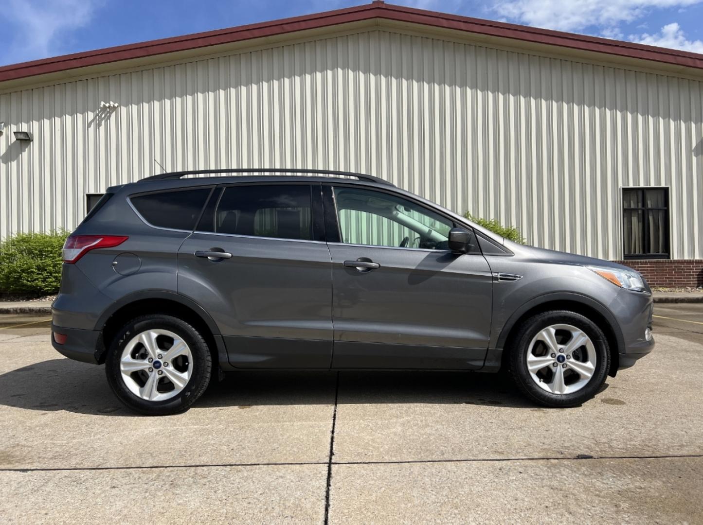 2014 GRAY /Black Leather Ford Escape SE FWD (1FMCU0GX1EU) with an 1.6L 4 Cyl. engine, Automatic transmission, located at 2990 Old Orchard Rd., Jackson, MO, 63755, 37.354214, -89.612106 - 2014 Ford Escape SE Only 90xxx miles Front Wheel Drive 1.6L 4 Cyl. Automatic Leather Power Driver Seat Heated Seats Backup Camera Bluetooth Cruise Power Windows/Locks/Mirrors We have financing available and we accept trades! Fill out a credit application on our website or come by today! - Photo#8