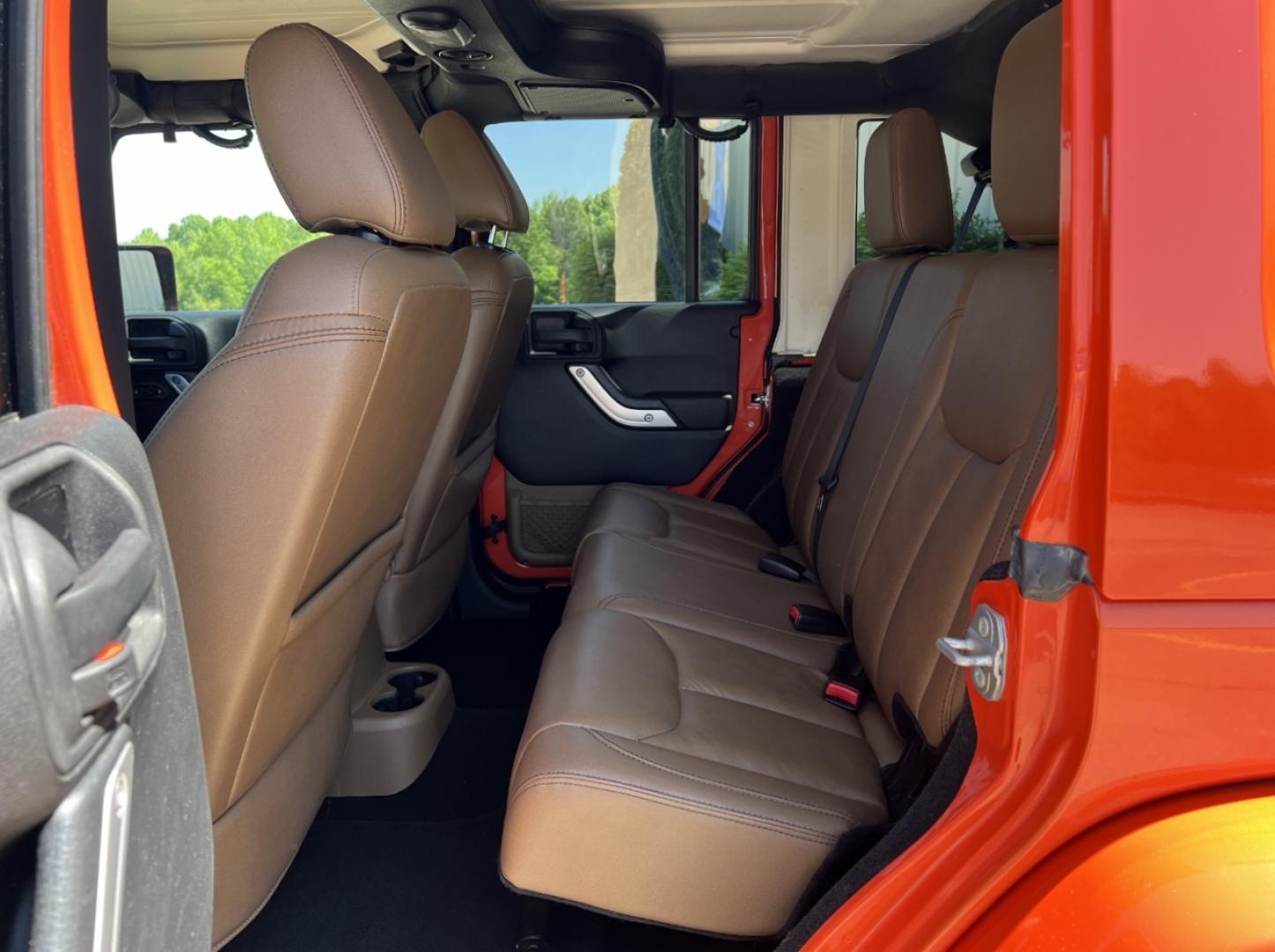 2015 ORANGE /Tan Leather Jeep Wrangler Unlimited Sahara 4WD (1C4BJWEG8FL) with an 3.6L V6 engine, Automatic transmission, located at 506 S. Kingshighway, Cape Girardeau, MO, 63703, (573) 235-5000, 37.294994, -89.556206 - 2015 Jeep Wrangler Unlimited Sahara 103xxx miles 4x4 3.6L V6 Automatic Leather Heated Seats Cruise Power Windows/Locks/Mirrors We have financing available and we accept trades! Fill out a credit application on our website or come by today! If you have any questions, give us a call at (573) - Photo#15