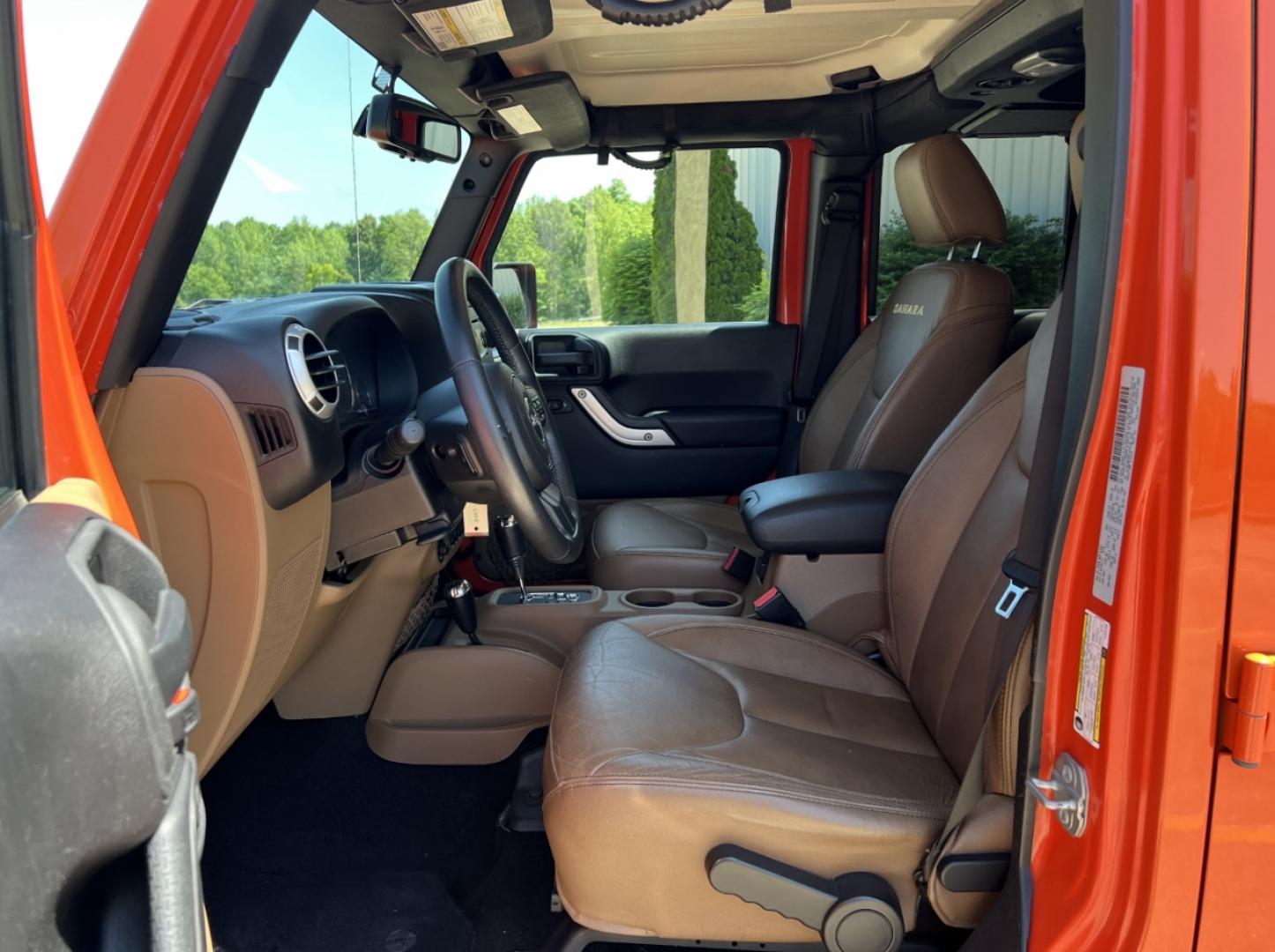 2015 ORANGE /Tan Leather Jeep Wrangler Unlimited Sahara 4WD (1C4BJWEG8FL) with an 3.6L V6 engine, Automatic transmission, located at 506 S. Kingshighway, Cape Girardeau, MO, 63703, (573) 235-5000, 37.294994, -89.556206 - 2015 Jeep Wrangler Unlimited Sahara 103xxx miles 4x4 3.6L V6 Automatic Leather Heated Seats Cruise Power Windows/Locks/Mirrors We have financing available and we accept trades! Fill out a credit application on our website or come by today! If you have any questions, give us a call at (573) - Photo#12