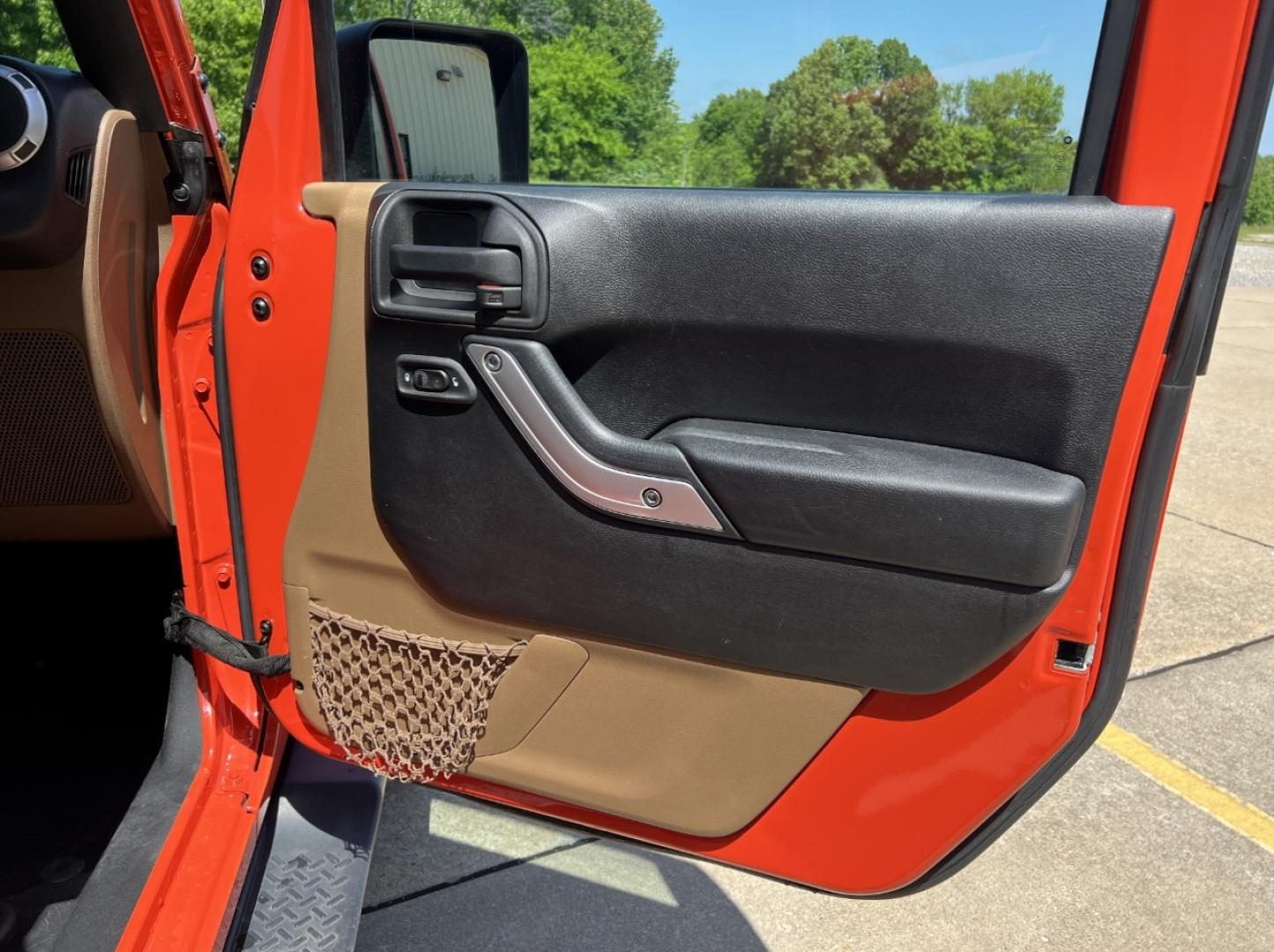 2015 ORANGE /Tan Leather Jeep Wrangler Unlimited Sahara 4WD (1C4BJWEG8FL) with an 3.6L V6 engine, Automatic transmission, located at 506 S. Kingshighway, Cape Girardeau, MO, 63703, (573) 235-5000, 37.294994, -89.556206 - 2015 Jeep Wrangler Unlimited Sahara 103xxx miles 4x4 3.6L V6 Automatic Leather Heated Seats Cruise Power Windows/Locks/Mirrors We have financing available and we accept trades! Fill out a credit application on our website or come by today! If you have any questions, give us a call at (573) - Photo#13