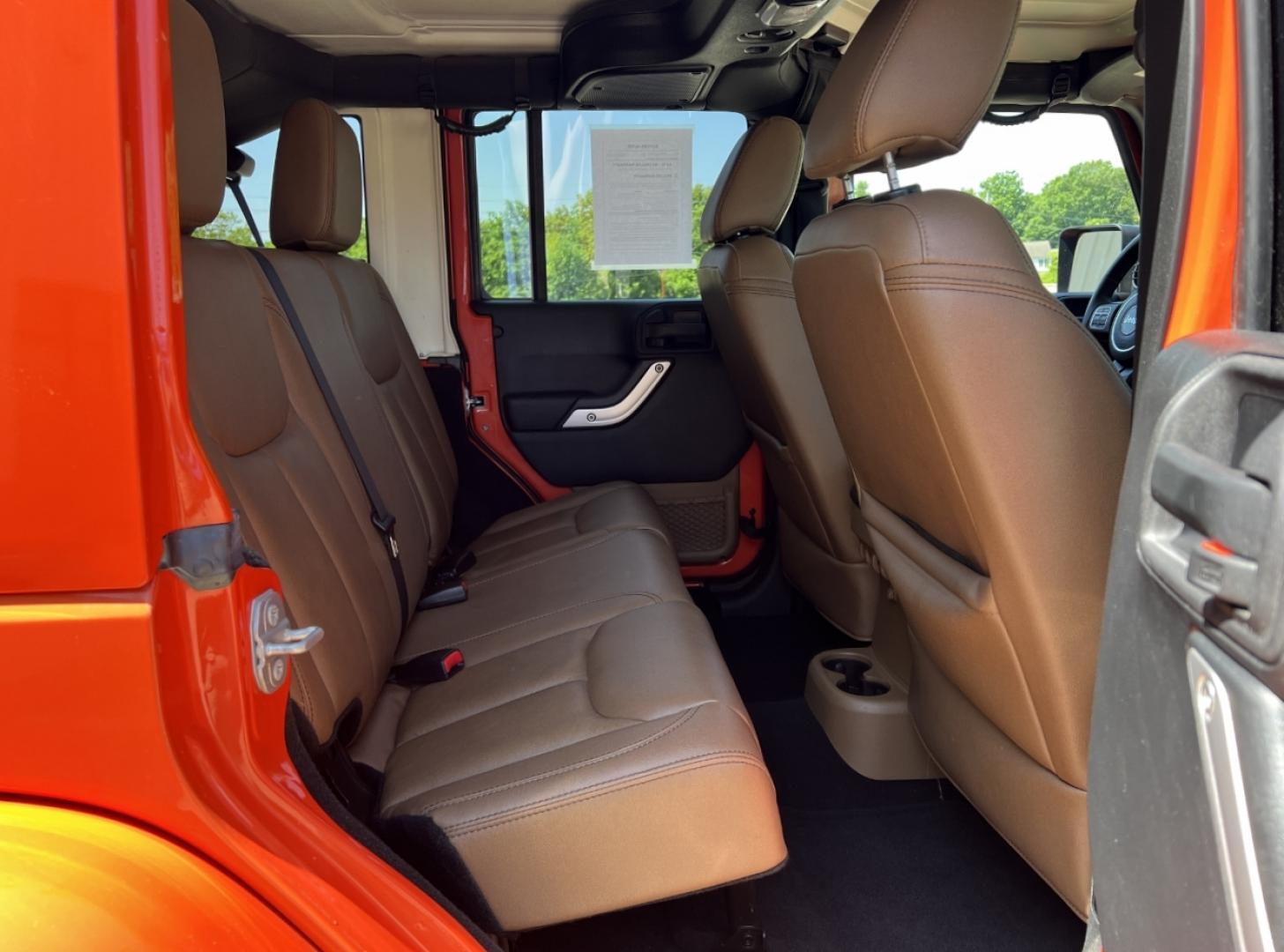 2015 ORANGE /Tan Leather Jeep Wrangler Unlimited Sahara 4WD (1C4BJWEG8FL) with an 3.6L V6 engine, Automatic transmission, located at 506 S. Kingshighway, Cape Girardeau, MO, 63703, (573) 235-5000, 37.294994, -89.556206 - 2015 Jeep Wrangler Unlimited Sahara 103xxx miles 4x4 3.6L V6 Automatic Leather Heated Seats Cruise Power Windows/Locks/Mirrors We have financing available and we accept trades! Fill out a credit application on our website or come by today! If you have any questions, give us a call at (573) - Photo#16