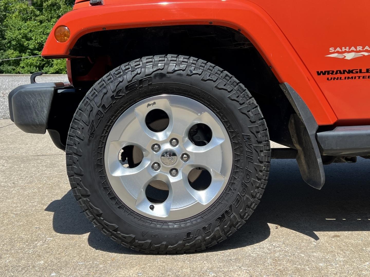 2015 ORANGE /Tan Leather Jeep Wrangler Unlimited Sahara 4WD (1C4BJWEG8FL) with an 3.6L V6 engine, Automatic transmission, located at 506 S. Kingshighway, Cape Girardeau, MO, 63703, (573) 235-5000, 37.294994, -89.556206 - 2015 Jeep Wrangler Unlimited Sahara 103xxx miles 4x4 3.6L V6 Automatic Leather Heated Seats Cruise Power Windows/Locks/Mirrors We have financing available and we accept trades! Fill out a credit application on our website or come by today! If you have any questions, give us a call at (573) - Photo#28