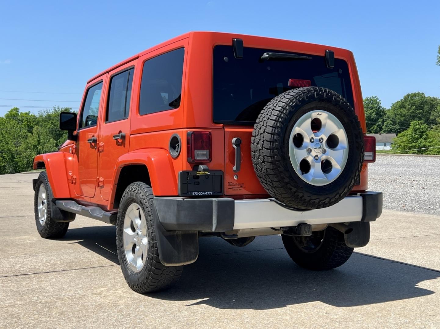 2015 ORANGE /Tan Leather Jeep Wrangler Unlimited Sahara 4WD (1C4BJWEG8FL) with an 3.6L V6 engine, Automatic transmission, located at 506 S. Kingshighway, Cape Girardeau, MO, 63703, (573) 235-5000, 37.294994, -89.556206 - 2015 Jeep Wrangler Unlimited Sahara 103xxx miles 4x4 3.6L V6 Automatic Leather Heated Seats Cruise Power Windows/Locks/Mirrors We have financing available and we accept trades! Fill out a credit application on our website or come by today! If you have any questions, give us a call at (573) - Photo#8