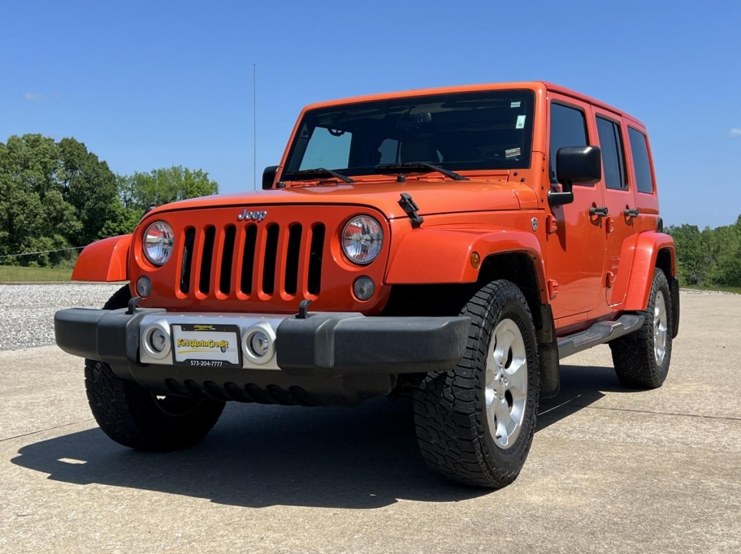 2015 ORANGE /Tan Leather Jeep Wrangler Unlimited Sahara 4WD (1C4BJWEG8FL) with an 3.6L V6 engine, Automatic transmission, located at 506 S. Kingshighway, Cape Girardeau, MO, 63703, (573) 235-5000, 37.294994, -89.556206 - 2015 Jeep Wrangler Unlimited Sahara 103xxx miles 4x4 3.6L V6 Automatic Leather Heated Seats Cruise Power Windows/Locks/Mirrors We have financing available and we accept trades! Fill out a credit application on our website or come by today! If you have any questions, give us a call at (573) - Photo#4