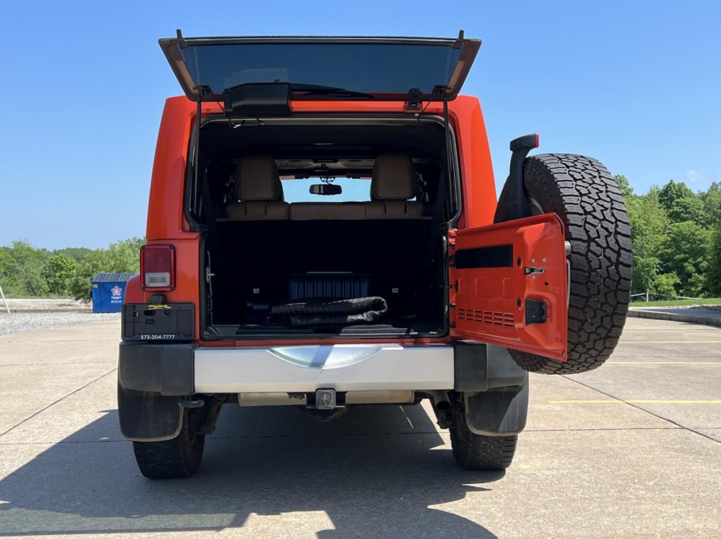 2015 ORANGE /Tan Leather Jeep Wrangler Unlimited Sahara 4WD (1C4BJWEG8FL) with an 3.6L V6 engine, Automatic transmission, located at 506 S. Kingshighway, Cape Girardeau, MO, 63703, (573) 235-5000, 37.294994, -89.556206 - 2015 Jeep Wrangler Unlimited Sahara 103xxx miles 4x4 3.6L V6 Automatic Leather Heated Seats Cruise Power Windows/Locks/Mirrors We have financing available and we accept trades! Fill out a credit application on our website or come by today! If you have any questions, give us a call at (573) - Photo#17