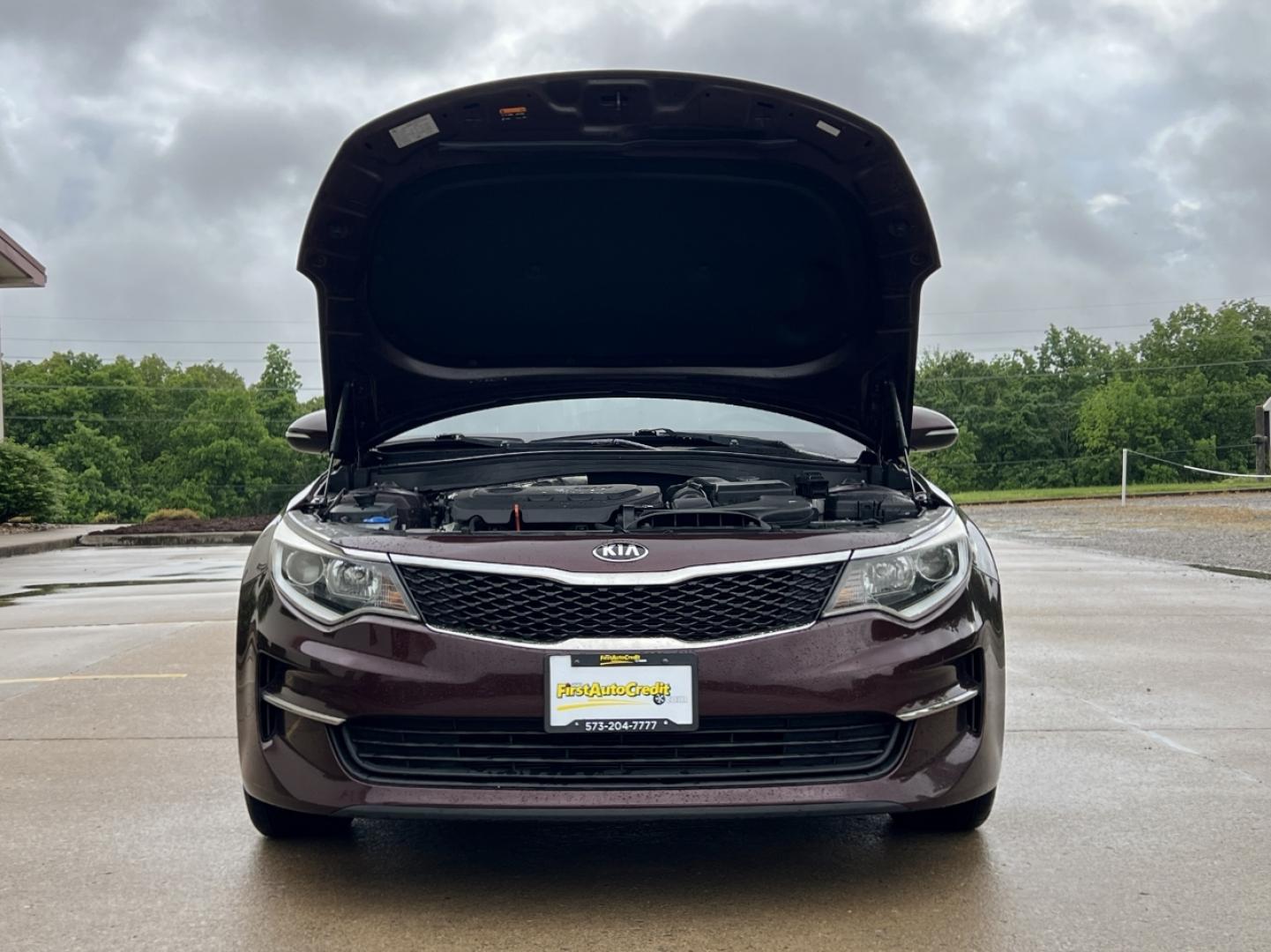 2016 MAROON /Black Cloth Kia Optima LX (5XXGT4L37GG) with an 2.4L 4 Cyl. engine, Automatic transmission, located at 506 S. Kingshighway, Cape Girardeau, MO, 63703, (573) 235-5000, 37.294994, -89.556206 - 2016 Kia Optima LX 112xxx miles Front Wheel Drive 2.4L 4 Cyl. Automatic Backup Camera Bluetooth Cruise Power Windows/Locks/Mirrors We have financing available and we accept trades! Fill out a credit application on our website or come by today! If you have any questions, give us a call at ( - Photo#26