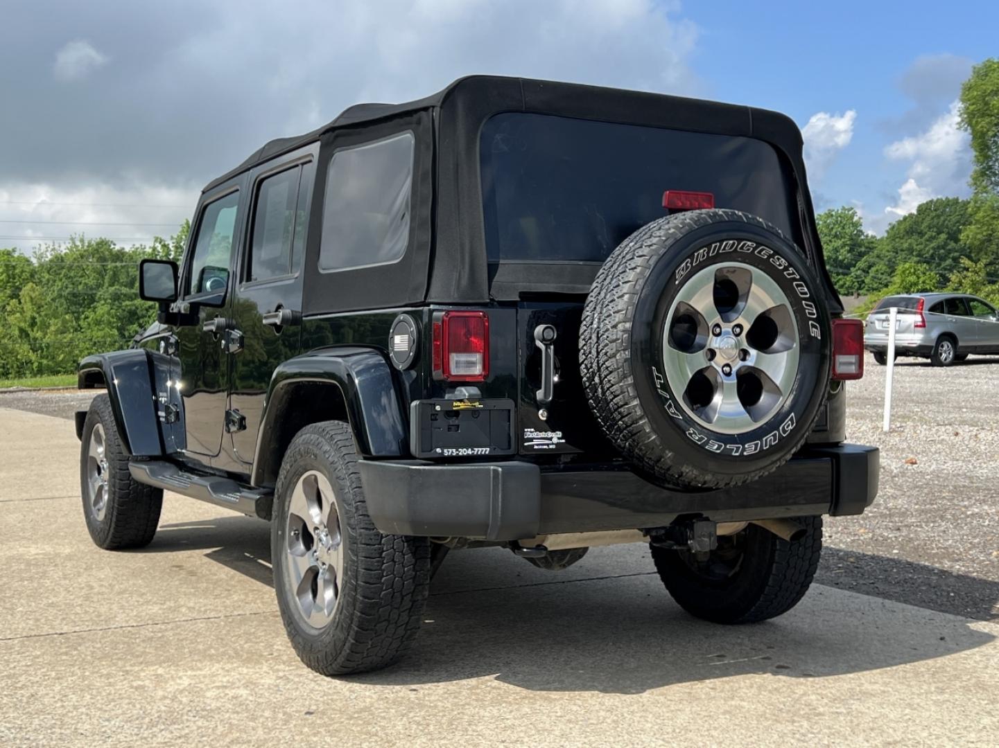 2016 BLACK /Black Cloth Jeep Wrangler Unlimited Sahara 4WD (1C4BJWEG6GL) with an 3.6L V6 engine, Manual transmission, located at 2990 Old Orchard Rd., Jackson, MO, 63755, 37.354214, -89.612106 - 2016 Jeep Wrangler Unlimited Sahara Only 90xxx miles 4x4 3.6L V6 6-Speed Manual Cruise Power Windows/Locks/Mirrors We have financing available and we accept trades! Fill out a credit application on our website or come by today! If you have any questions, give us a call at (573) 204-7777 or v - Photo#7