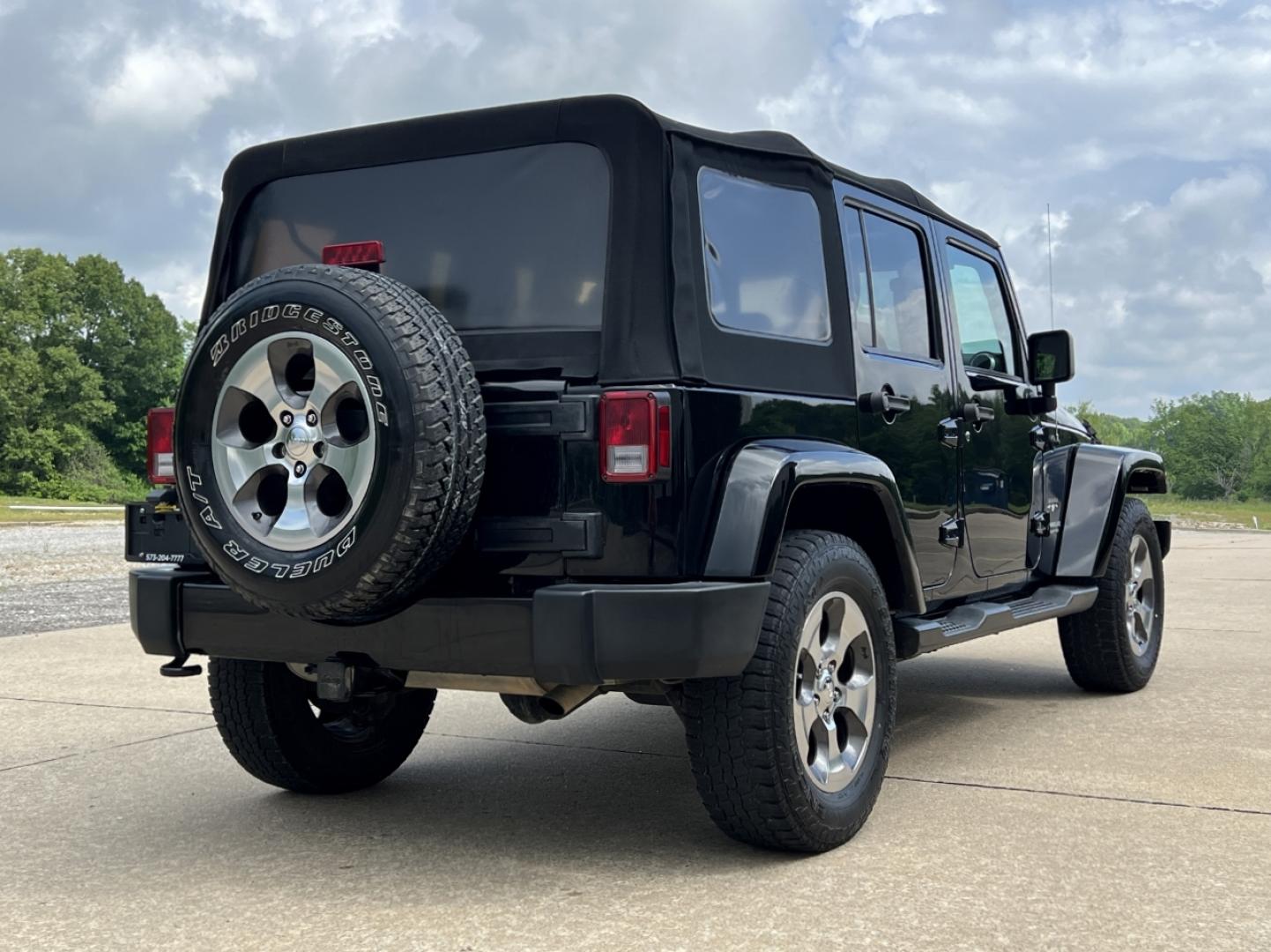 2016 BLACK /Black Cloth Jeep Wrangler Unlimited Sahara 4WD (1C4BJWEG6GL) with an 3.6L V6 engine, Manual transmission, located at 2990 Old Orchard Rd., Jackson, MO, 63755, 37.354214, -89.612106 - 2016 Jeep Wrangler Unlimited Sahara Only 90xxx miles 4x4 3.6L V6 6-Speed Manual Cruise Power Windows/Locks/Mirrors We have financing available and we accept trades! Fill out a credit application on our website or come by today! If you have any questions, give us a call at (573) 204-7777 or v - Photo#6