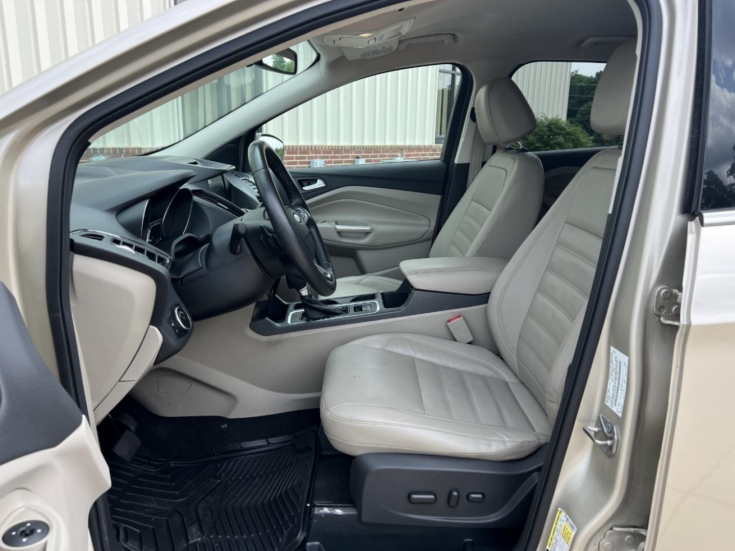 2017 GOLD /Tan Leather Ford Escape Titanium FWD (1FMCU0JD2HU) with an 1.5L 4 Cyl. engine, Automatic transmission, located at 2990 Old Orchard Rd., Jackson, MO, 63755, 37.354214, -89.612106 - 2017 Ford Escape Titanium 86xxx miles Front Wheel Drive 1.5L 4 Cyl. Automatic Leather Power/Heated Seats Backup Camera Bluetooth Remote Start Cruise Power Windows/Locks/Mirrors We have financing available and we accept trades! Fill out a credit application on our website or come by today - Photo#14