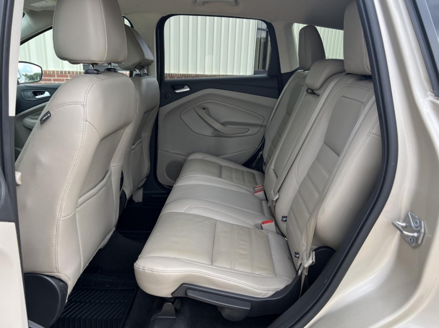 2017 GOLD /Tan Leather Ford Escape Titanium FWD (1FMCU0JD2HU) with an 1.5L 4 Cyl. engine, Automatic transmission, located at 2990 Old Orchard Rd., Jackson, MO, 63755, 37.354214, -89.612106 - 2017 Ford Escape Titanium 86xxx miles Front Wheel Drive 1.5L 4 Cyl. Automatic Leather Power/Heated Seats Backup Camera Bluetooth Remote Start Cruise Power Windows/Locks/Mirrors We have financing available and we accept trades! Fill out a credit application on our website or come by today - Photo#17