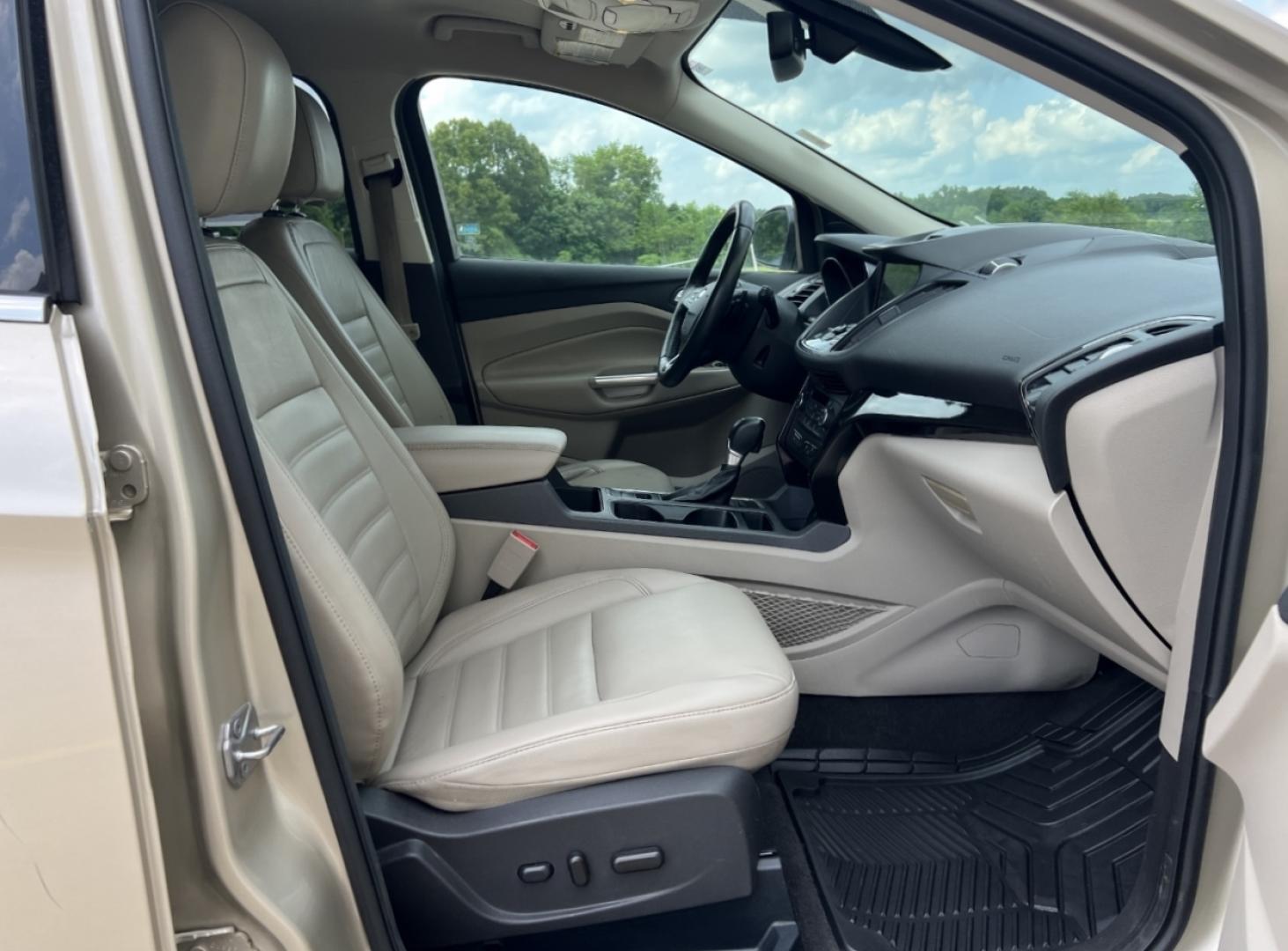 2017 GOLD /Tan Leather Ford Escape Titanium FWD (1FMCU0JD2HU) with an 1.5L 4 Cyl. engine, Automatic transmission, located at 2990 Old Orchard Rd., Jackson, MO, 63755, 37.354214, -89.612106 - 2017 Ford Escape Titanium 86xxx miles Front Wheel Drive 1.5L 4 Cyl. Automatic Leather Power/Heated Seats Backup Camera Bluetooth Remote Start Cruise Power Windows/Locks/Mirrors We have financing available and we accept trades! Fill out a credit application on our website or come by today - Photo#16