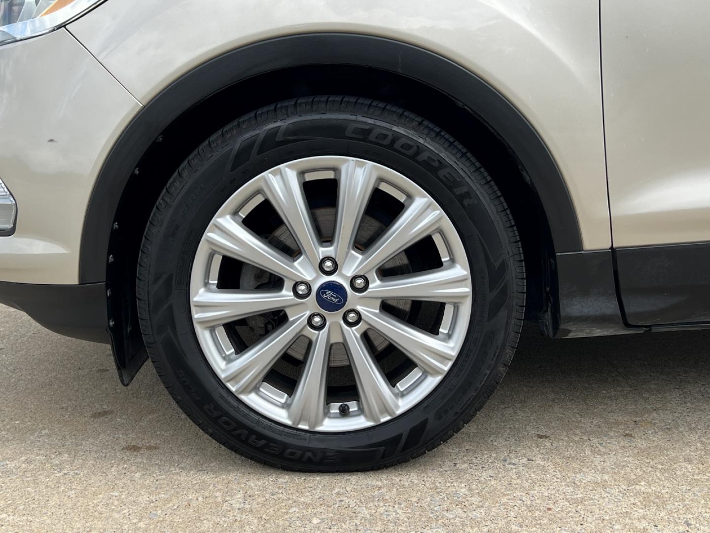 2017 GOLD /Tan Leather Ford Escape Titanium FWD (1FMCU0JD2HU) with an 1.5L 4 Cyl. engine, Automatic transmission, located at 2990 Old Orchard Rd., Jackson, MO, 63755, 37.354214, -89.612106 - 2017 Ford Escape Titanium 86xxx miles Front Wheel Drive 1.5L 4 Cyl. Automatic Leather Power/Heated Seats Backup Camera Bluetooth Remote Start Cruise Power Windows/Locks/Mirrors We have financing available and we accept trades! Fill out a credit application on our website or come by today - Photo#38