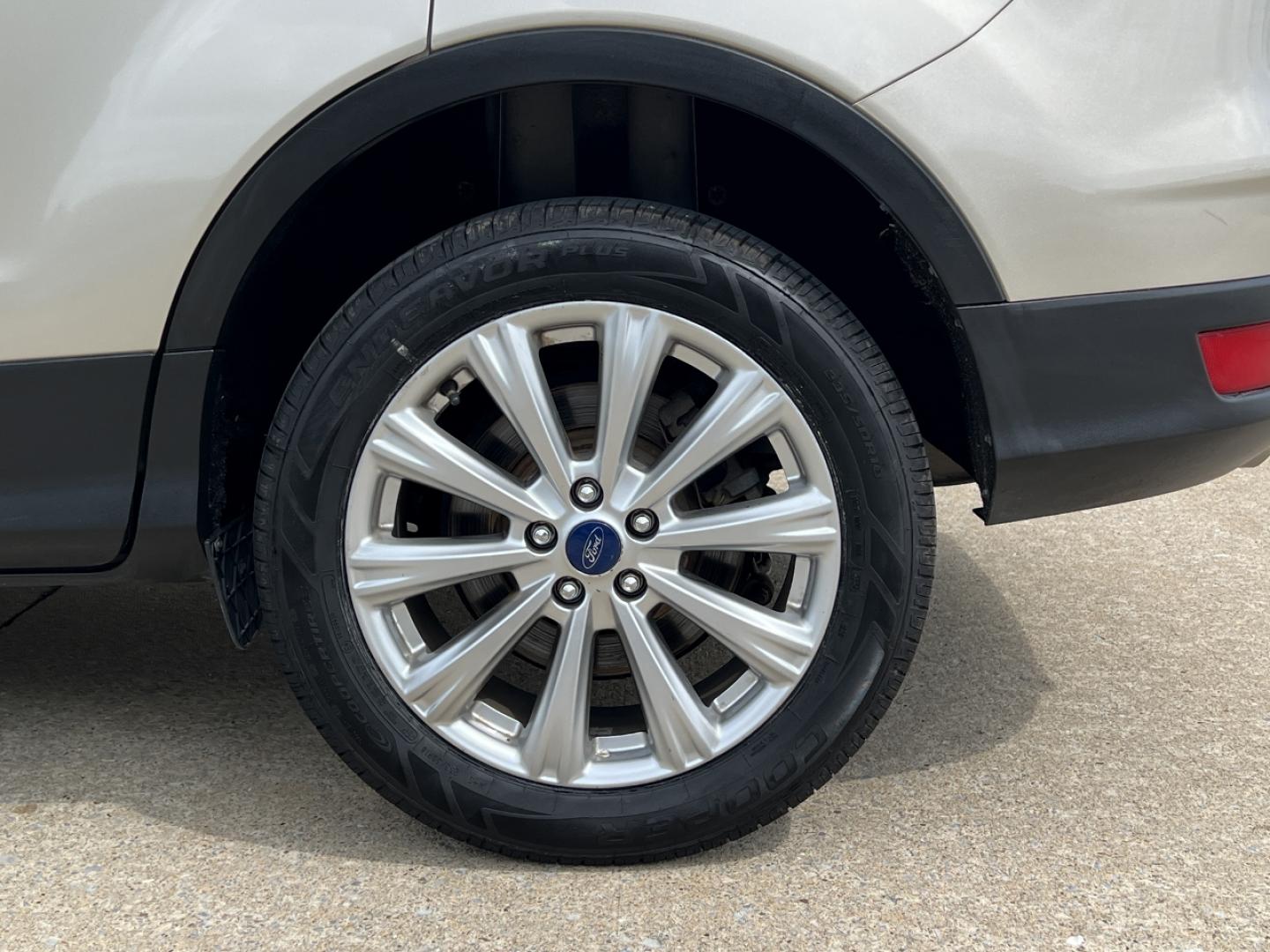 2017 GOLD /Tan Leather Ford Escape Titanium FWD (1FMCU0JD2HU) with an 1.5L 4 Cyl. engine, Automatic transmission, located at 2990 Old Orchard Rd., Jackson, MO, 63755, 37.354214, -89.612106 - 2017 Ford Escape Titanium 86xxx miles Front Wheel Drive 1.5L 4 Cyl. Automatic Leather Power/Heated Seats Backup Camera Bluetooth Remote Start Cruise Power Windows/Locks/Mirrors We have financing available and we accept trades! Fill out a credit application on our website or come by today - Photo#40
