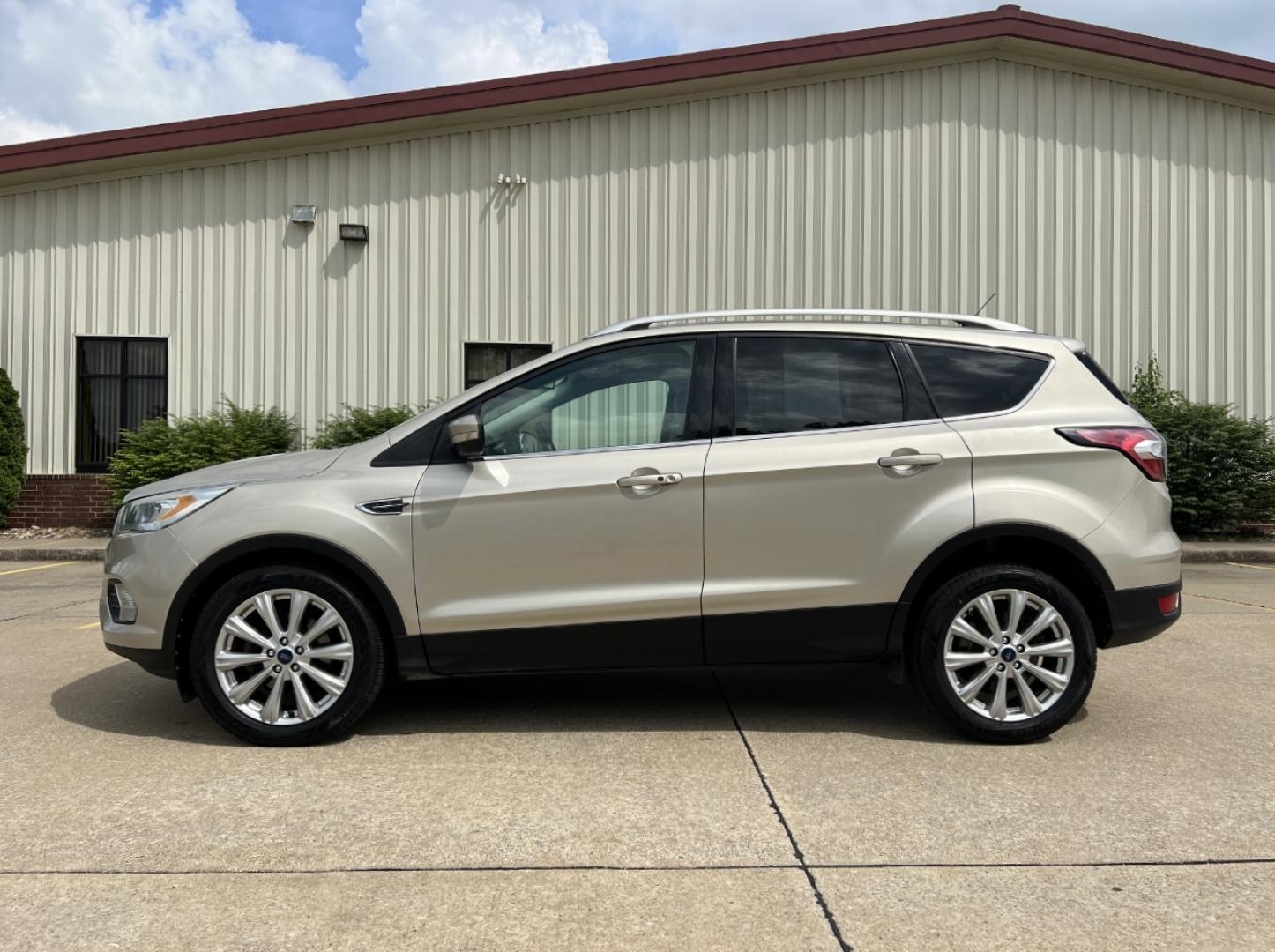 2017 GOLD /Tan Leather Ford Escape Titanium FWD (1FMCU0JD2HU) with an 1.5L 4 Cyl. engine, Automatic transmission, located at 2990 Old Orchard Rd., Jackson, MO, 63755, 37.354214, -89.612106 - 2017 Ford Escape Titanium 86xxx miles Front Wheel Drive 1.5L 4 Cyl. Automatic Leather Power/Heated Seats Backup Camera Bluetooth Remote Start Cruise Power Windows/Locks/Mirrors We have financing available and we accept trades! Fill out a credit application on our website or come by today - Photo#7