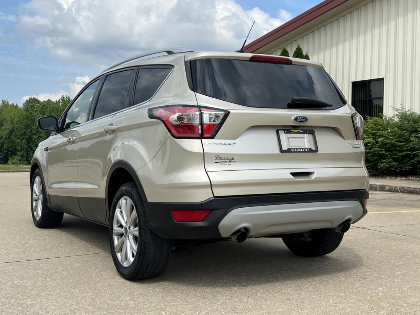 2017 GOLD /Tan Leather Ford Escape Titanium FWD (1FMCU0JD2HU) with an 1.5L 4 Cyl. engine, Automatic transmission, located at 2990 Old Orchard Rd., Jackson, MO, 63755, 37.354214, -89.612106 - 2017 Ford Escape Titanium 86xxx miles Front Wheel Drive 1.5L 4 Cyl. Automatic Leather Power/Heated Seats Backup Camera Bluetooth Remote Start Cruise Power Windows/Locks/Mirrors We have financing available and we accept trades! Fill out a credit application on our website or come by today - Photo#10