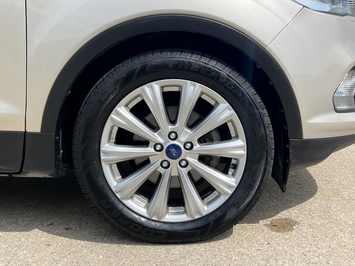 2017 GOLD /Tan Leather Ford Escape Titanium FWD (1FMCU0JD2HU) with an 1.5L 4 Cyl. engine, Automatic transmission, located at 2990 Old Orchard Rd., Jackson, MO, 63755, 37.354214, -89.612106 - 2017 Ford Escape Titanium 86xxx miles Front Wheel Drive 1.5L 4 Cyl. Automatic Leather Power/Heated Seats Backup Camera Bluetooth Remote Start Cruise Power Windows/Locks/Mirrors We have financing available and we accept trades! Fill out a credit application on our website or come by today - Photo#42