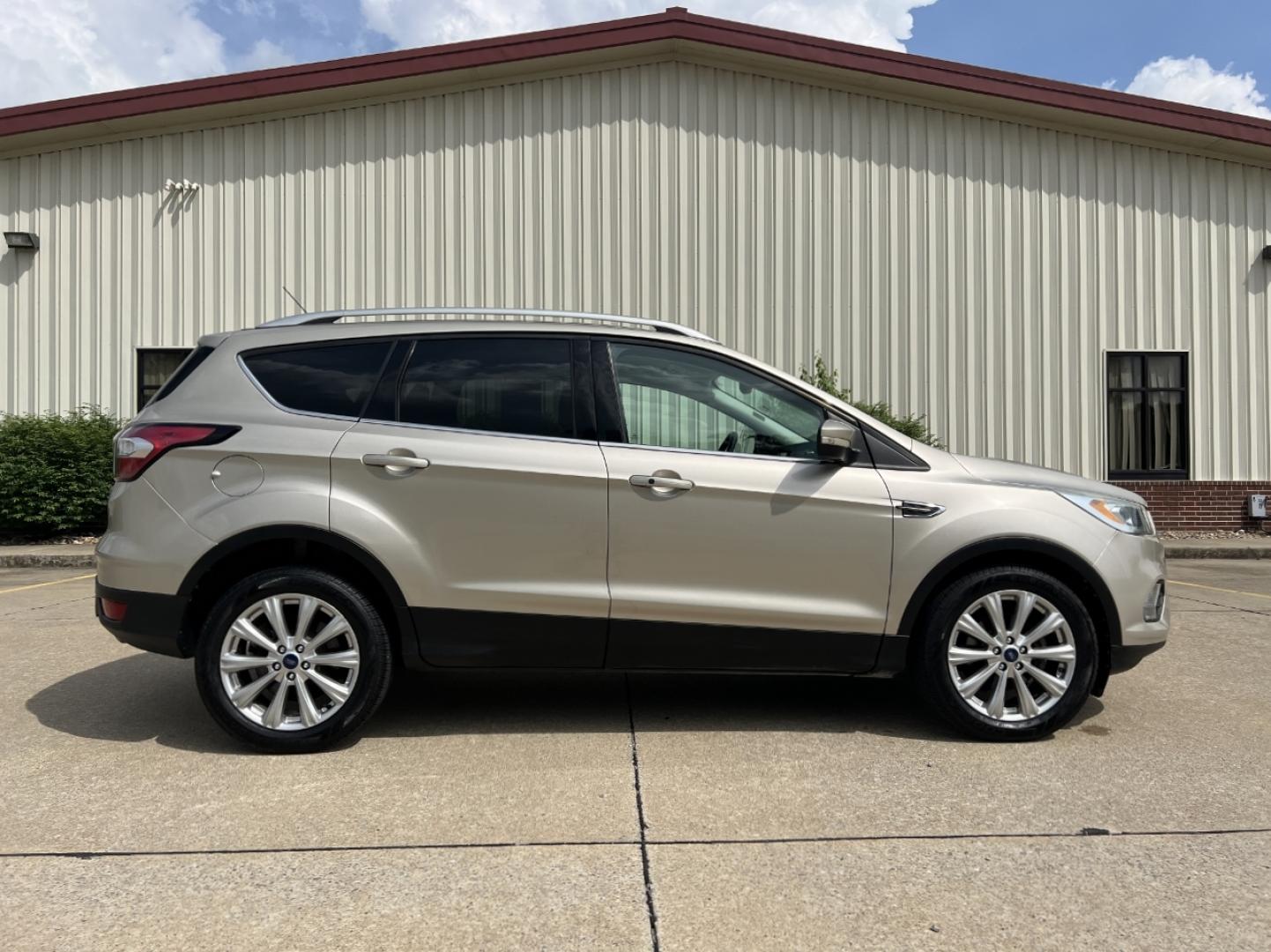 2017 GOLD /Tan Leather Ford Escape Titanium FWD (1FMCU0JD2HU) with an 1.5L 4 Cyl. engine, Automatic transmission, located at 2990 Old Orchard Rd., Jackson, MO, 63755, 37.354214, -89.612106 - 2017 Ford Escape Titanium 86xxx miles Front Wheel Drive 1.5L 4 Cyl. Automatic Leather Power/Heated Seats Backup Camera Bluetooth Remote Start Cruise Power Windows/Locks/Mirrors We have financing available and we accept trades! Fill out a credit application on our website or come by today - Photo#8