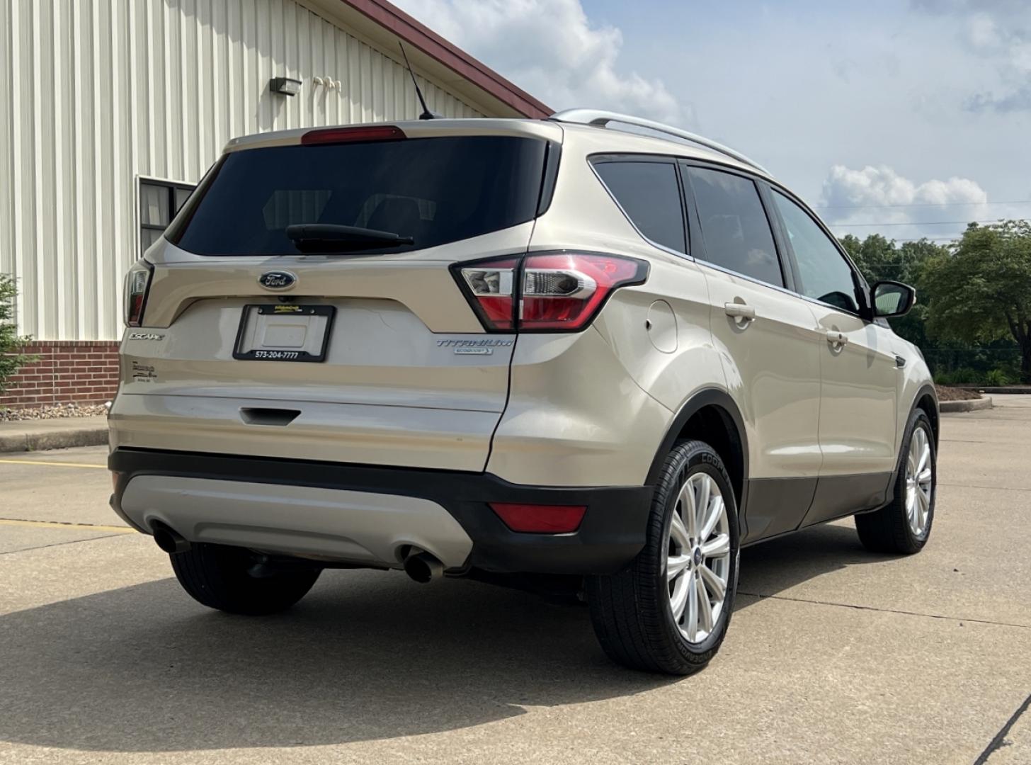 2017 GOLD /Tan Leather Ford Escape Titanium FWD (1FMCU0JD2HU) with an 1.5L 4 Cyl. engine, Automatic transmission, located at 2990 Old Orchard Rd., Jackson, MO, 63755, 37.354214, -89.612106 - 2017 Ford Escape Titanium 86xxx miles Front Wheel Drive 1.5L 4 Cyl. Automatic Leather Power/Heated Seats Backup Camera Bluetooth Remote Start Cruise Power Windows/Locks/Mirrors We have financing available and we accept trades! Fill out a credit application on our website or come by today - Photo#9