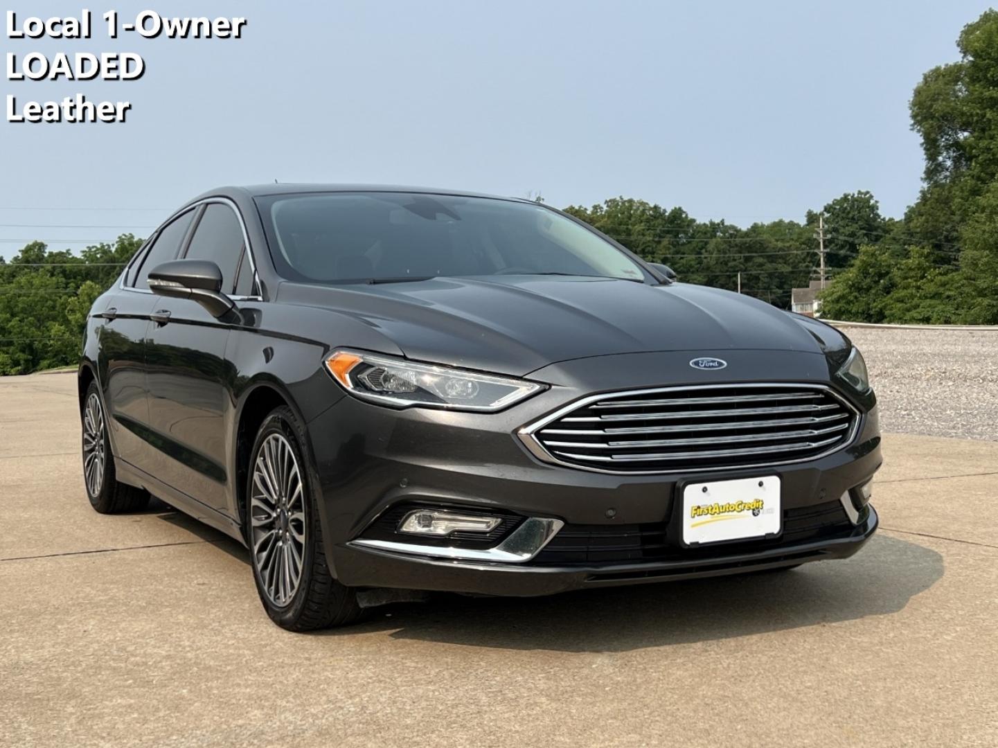 2018 GRAY /Black Leather Ford Fusion Titanium (3FA6P0K94JR) with an 2.0L 4 Cyl. engine, Automatic transmission, located at 2990 Old Orchard Rd., Jackson, MO, 63755, 37.354214, -89.612106 - 2018 Ford Fusion Titanium Local 1-Owner 83xxx miles Front Wheel Drive 2.0L 4 Cyl. Automatic Leather Navigation Backup Camera Power/Heated Seats Sunroof Bluetooth Remote Start Cruise Power Windows/Locks/Mirrors We have financing available and we accept trades! Fill out a credit applica - Photo#0