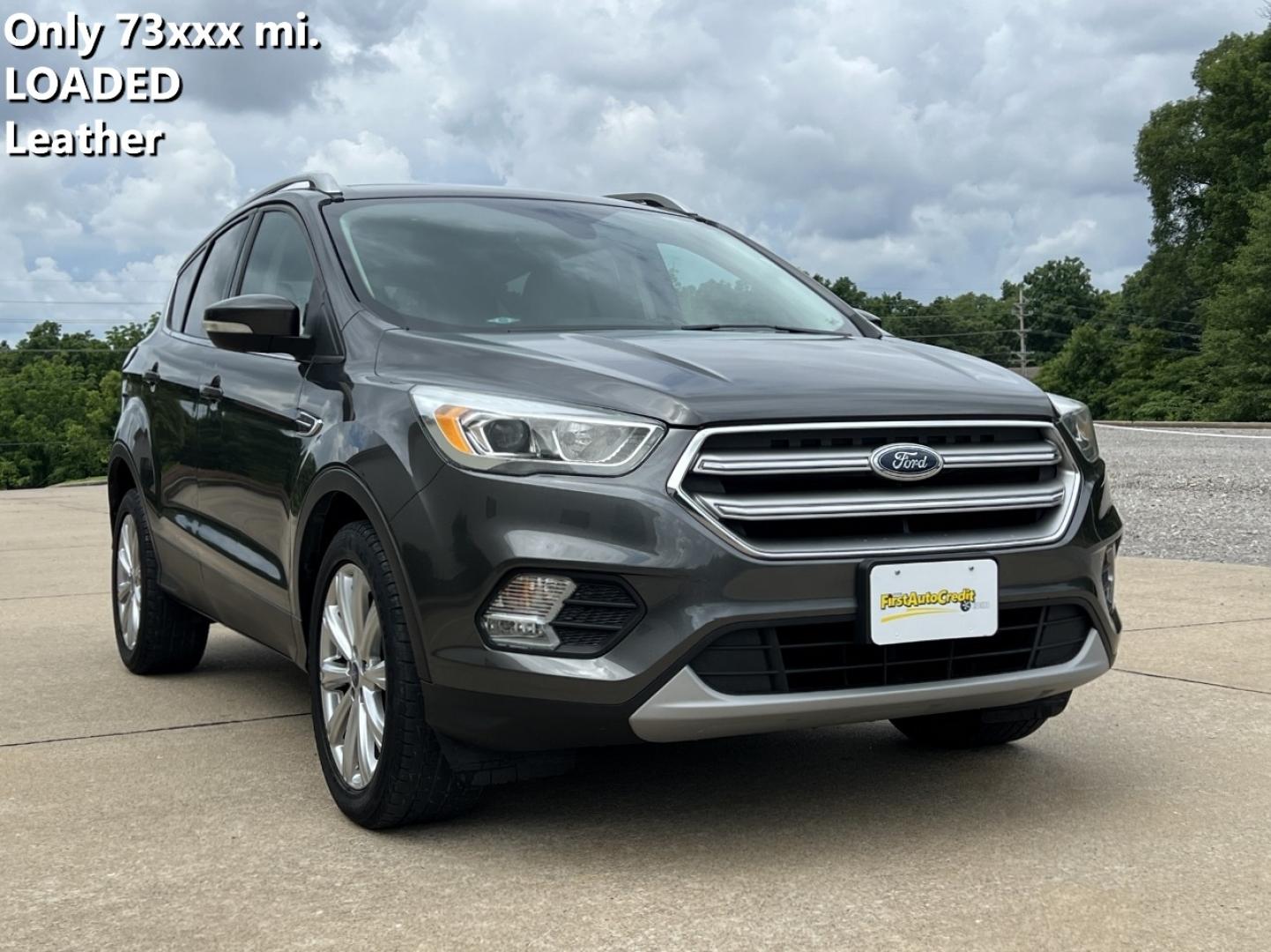 2017 GRAY /Tan Leather Ford Escape Titanium FWD (1FMCU0JD0HU) with an 1.5L 4 Cyl. engine, Automatic transmission, located at 2990 Old Orchard Rd., Jackson, MO, 63755, 37.354214, -89.612106 - 2017 Ford Escape Titanium Only 73xxx miles Front Wheel Drive 1.5L 4 Cyl. Automatic Leather Navigation Power/Heated Seats Backup Camera Bluetooth Remote Start Cruise Power Windows/Locks/Mirrors We have financing available and we accept trades! Fill out a credit application on our website - Photo#0