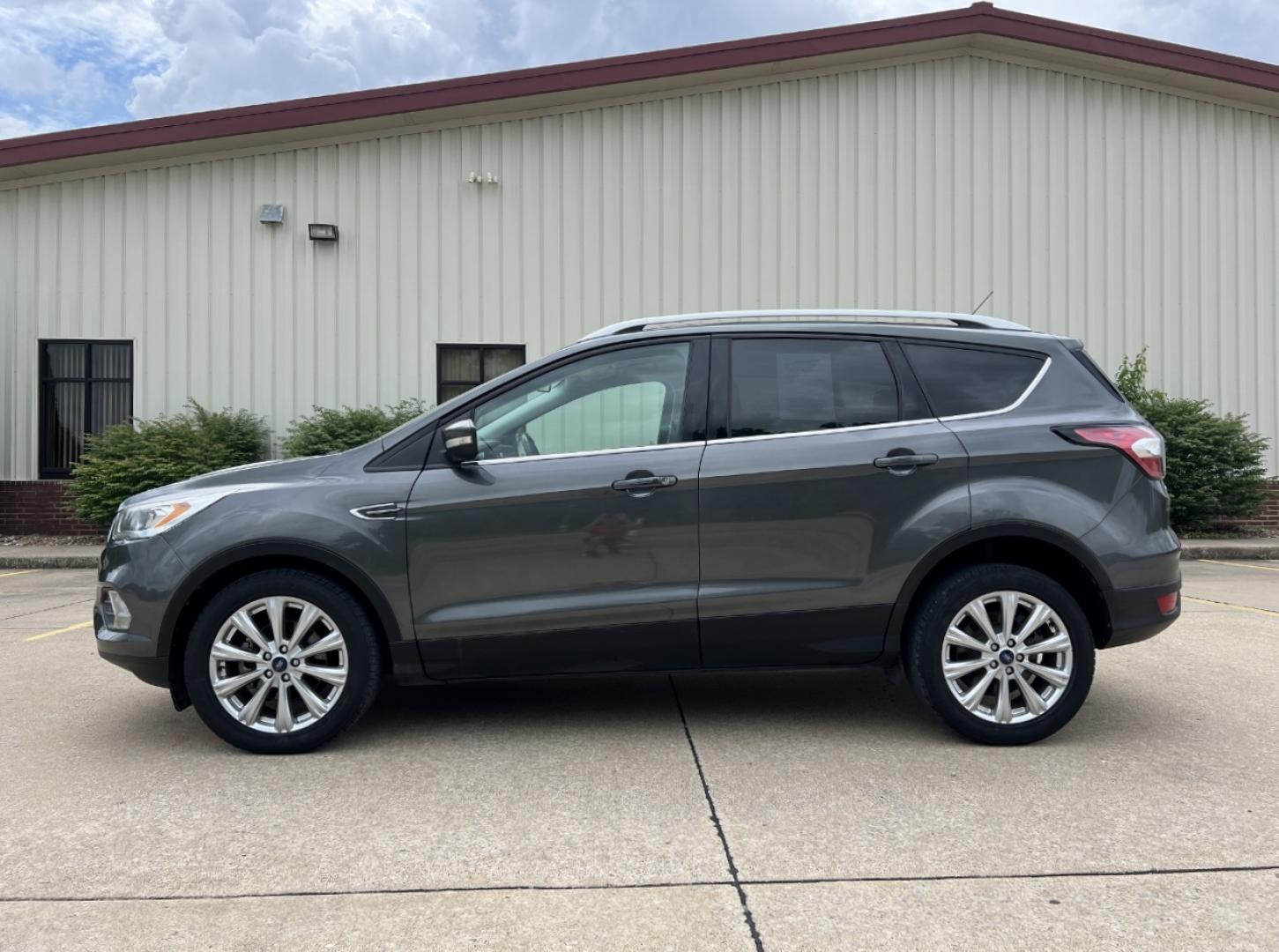 2017 GRAY /Tan Leather Ford Escape Titanium FWD (1FMCU0JD0HU) with an 1.5L 4 Cyl. engine, Automatic transmission, located at 2990 Old Orchard Rd., Jackson, MO, 63755, 37.354214, -89.612106 - 2017 Ford Escape Titanium Only 73xxx miles Front Wheel Drive 1.5L 4 Cyl. Automatic Leather Navigation Power/Heated Seats Backup Camera Bluetooth Remote Start Cruise Power Windows/Locks/Mirrors We have financing available and we accept trades! Fill out a credit application on our website - Photo#8