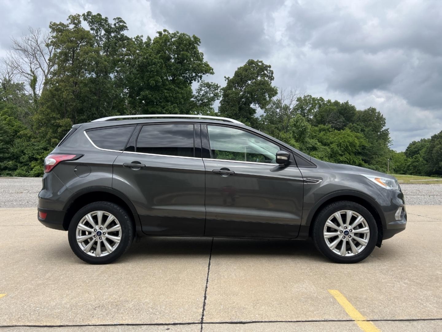 2017 GRAY /Tan Leather Ford Escape Titanium FWD (1FMCU0JD0HU) with an 1.5L 4 Cyl. engine, Automatic transmission, located at 2990 Old Orchard Rd., Jackson, MO, 63755, 37.354214, -89.612106 - 2017 Ford Escape Titanium Only 73xxx miles Front Wheel Drive 1.5L 4 Cyl. Automatic Leather Navigation Power/Heated Seats Backup Camera Bluetooth Remote Start Cruise Power Windows/Locks/Mirrors We have financing available and we accept trades! Fill out a credit application on our website - Photo#9