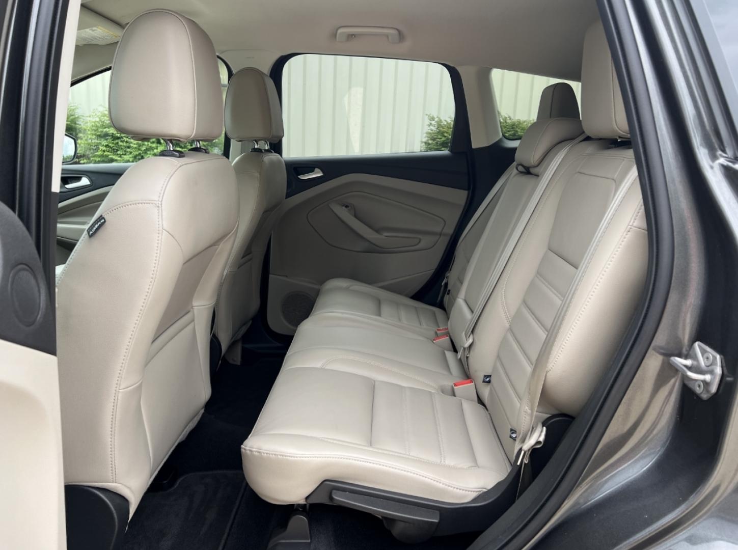 2017 GRAY /Tan Leather Ford Escape Titanium FWD (1FMCU0JD0HU) with an 1.5L 4 Cyl. engine, Automatic transmission, located at 2990 Old Orchard Rd., Jackson, MO, 63755, 37.354214, -89.612106 - 2017 Ford Escape Titanium Only 73xxx miles Front Wheel Drive 1.5L 4 Cyl. Automatic Leather Navigation Power/Heated Seats Backup Camera Bluetooth Remote Start Cruise Power Windows/Locks/Mirrors We have financing available and we accept trades! Fill out a credit application on our website - Photo#18