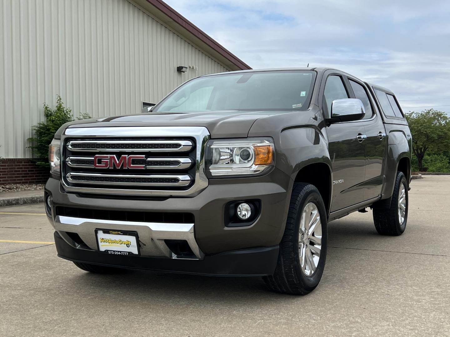 2015 BROWN /Tan Leather GMC Canyon SLT Crew Cab 4WD Short Box (1GTG6CE36F1) with an 3.6L V6 engine, Automatic transmission, located at 506 S. Kingshighway, Cape Girardeau, MO, 63703, (573) 235-5000, 37.294994, -89.556206 - 2015 GMC Canyon SLT 143xxx miles 4x4 3.6L V6 Leather Automatic Navigation Backup Camera Power/Heated Seats Cruise Power Windows/Locks/Mirrors We have financing available and we accept trades! Fill out a credit application on our website or come by today! If you have any questions, give u - Photo#6