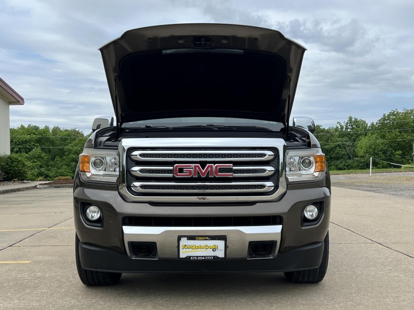2015 BROWN /Tan Leather GMC Canyon SLT Crew Cab 4WD Short Box (1GTG6CE36F1) with an 3.6L V6 engine, Automatic transmission, located at 506 S. Kingshighway, Cape Girardeau, MO, 63703, (573) 235-5000, 37.294994, -89.556206 - 2015 GMC Canyon SLT 143xxx miles 4x4 3.6L V6 Leather Automatic Navigation Backup Camera Power/Heated Seats Cruise Power Windows/Locks/Mirrors We have financing available and we accept trades! Fill out a credit application on our website or come by today! If you have any questions, give u - Photo#31