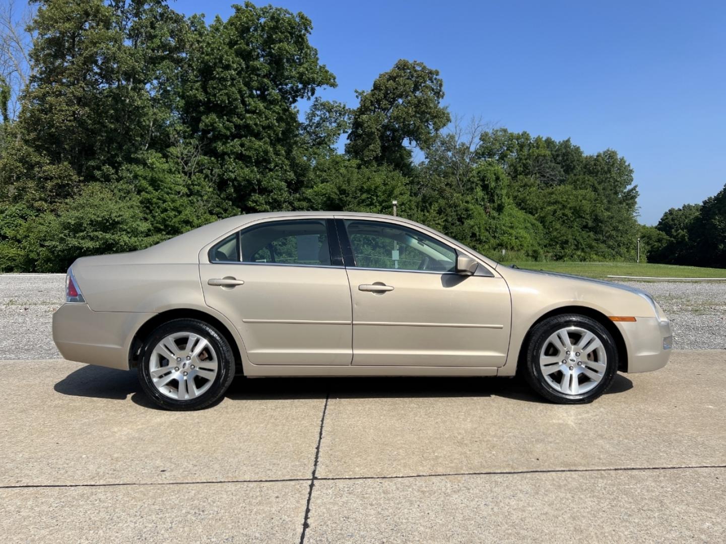 2006 GOLD /Tan Leather Ford Fusion V6 SEL (3FAHP08176R) with an 3.0L V6 engine, Automatic transmission, located at 506 S. Kingshighway, Cape Girardeau, MO, 63703, (573) 235-5000, 37.294991, -89.553635 - 2006 Ford Fusion SEL 128xxx miles Front Wheel Drive 3.0L V6 Automatic Leather Power Driver Seat Heated Seats Sunroof Cruise Power Windows/Locks/Mirrors We have financing available and we accept trades! Fill out a credit application on our website or come by today! If you have any questio - Photo#7